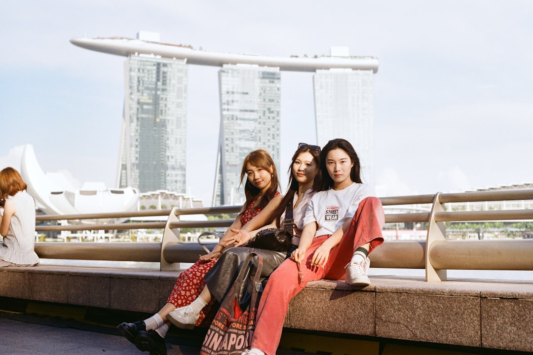 three-women-pose-with-marina-bay-sands-in-singapore-x-don-ctbyu